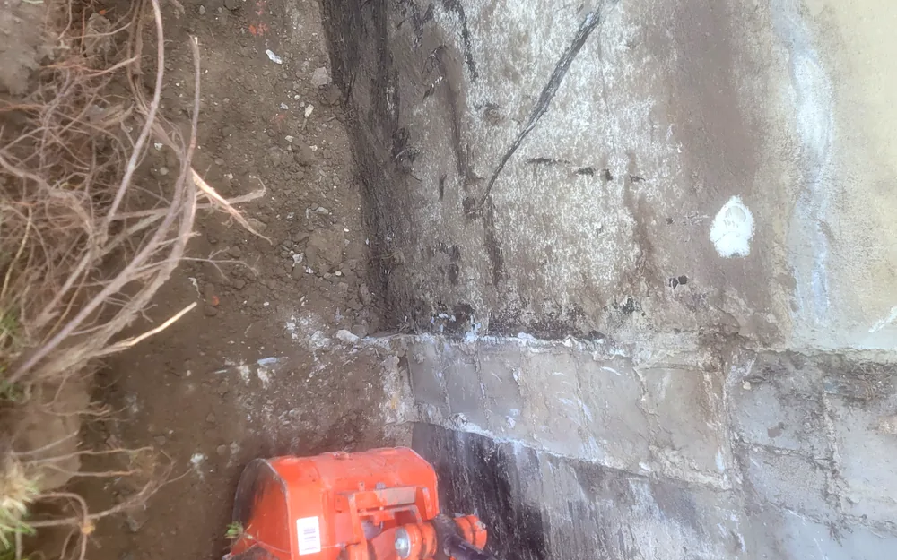 Vertical crack running through a poured-concrete foundation wall